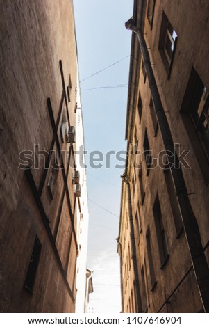 Line-like space between two old buildings in the center of Saint-Petersburg