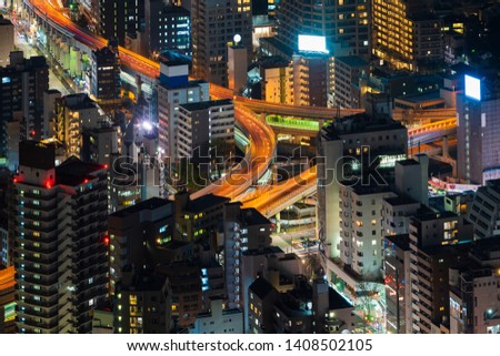 Aerial view of the Metropolitan Expressway junction and city at night, Tokyo, Japan