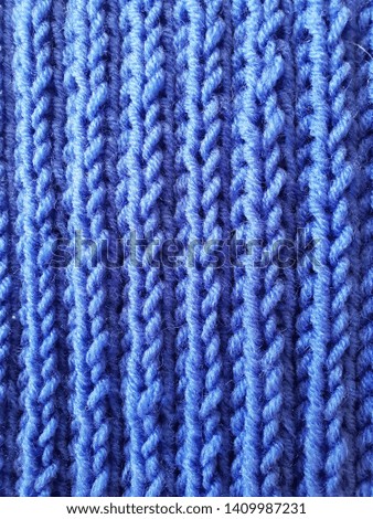 Texture knitted blue canvas. Macro