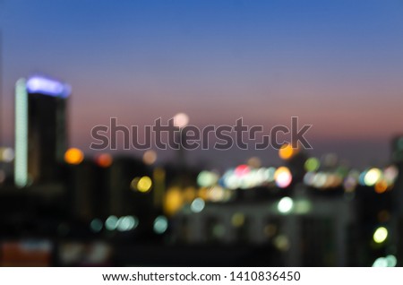 Abstract background of blurred night downtown city lights at twilight