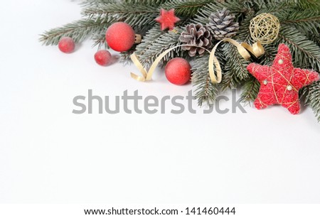 Christmas decoration with the twigs of the spruce and baubles