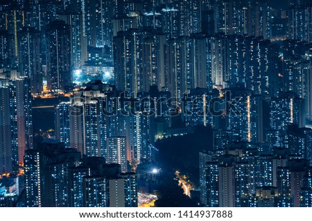 City Aerial view skyscrapers office lighting and Blinking light in apartments - Nighttime skyline City of a big modern building