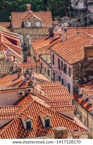 Cityscape of Dubrovnik with traditional red tiled roofs Mediterranean houses. Dubrovnik on Adriatic Sea is one of most prominent tourist destinations, UNESCO World Heritage Site. Croatia.