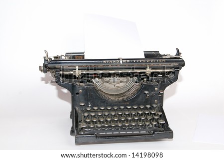 old fashioned, vintage typewriter isolated on white background with a blank sheet of paper inserted