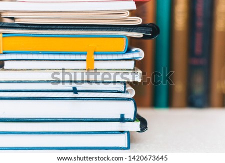 Notebooks piles, stack of books education back to school background with copy space for text