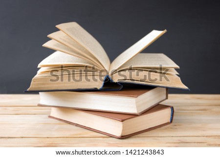 many books, view of top. Stack of old books on book shelf. Education and learning concept