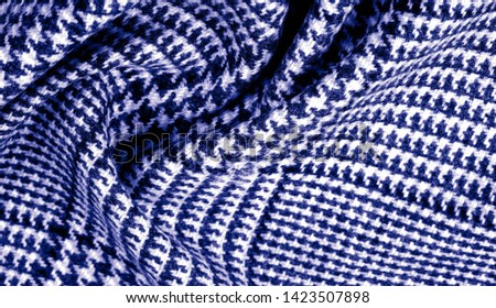 Background texture, pattern. The fabric is thick, warm with a checkered pattern, blue. Stop. You made the right choice by purchasing this photo, your design will be great with this image.