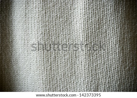 Bright beige woven material background or texture