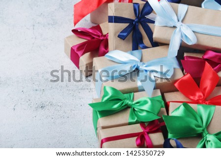 Gifting boxes with colorful satin ribbon bows