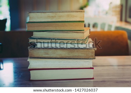 Old book stack on table