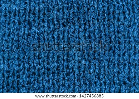 Knitted texture saturated dark blue. Background template for design banner, poster, wallpaper.
Saturated blue background