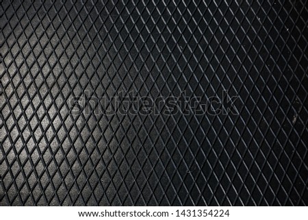 Black metal texture steel background. Perforated sheet metal.