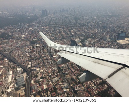 Flying over a polluted city