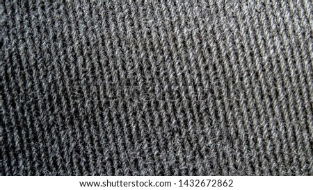 fabric texture of faded colored jeans.