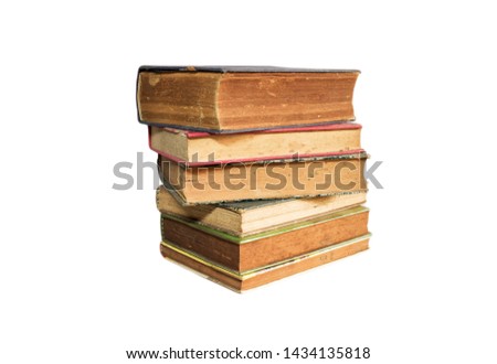 Old books stacked and isolated on white background
