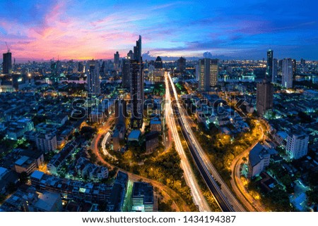 High angle view of buildings and street lights in the commercial district of Thailand during the twilight light