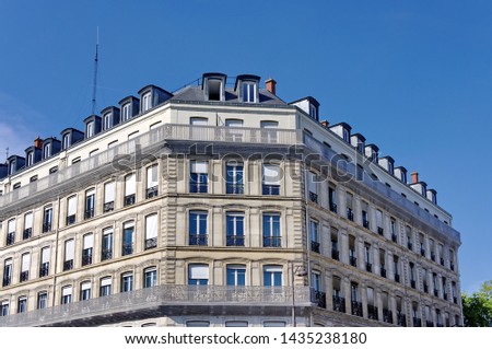 White stone building with blue sky, Paris, France.