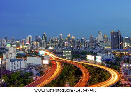 Bangkok cityscape. Traffic on the freeway in the business district. at dusk.