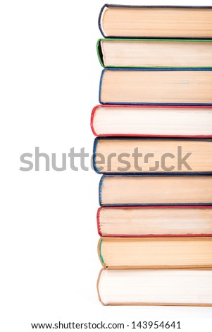 Multicolored books stack isolated on white background.