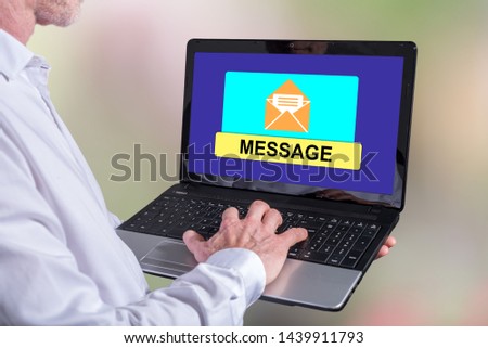 Man using a laptop with message concept on the screen
