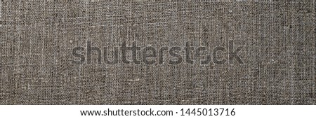 Grey linen cloth, close up macro. Old hemp burlap fabric, closeup