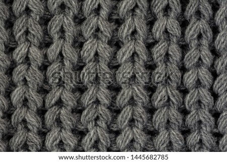Close up gray cotton fabric texture background. 
Macro Black and white textured knit fashion fabric background. 
Selective focus. top view. 