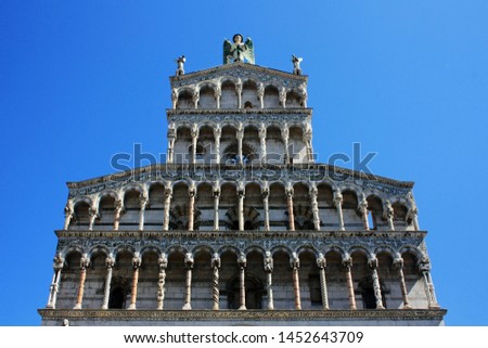Cathedral with an angel in the city of Lucca, Italy