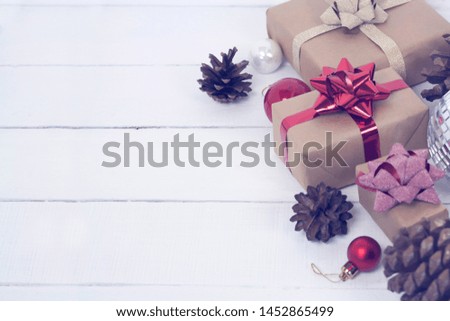 Happy new Year 2020 christmastime card. Gift boxes and christmas tree toys on background. Winter light rustic photo.
