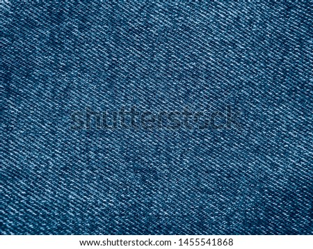 Retro color tone of blue denim jeans fabric texture for background website fashion design or backdrop product