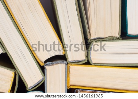 Old and used hardcover books, top view. Educational concept. Close up