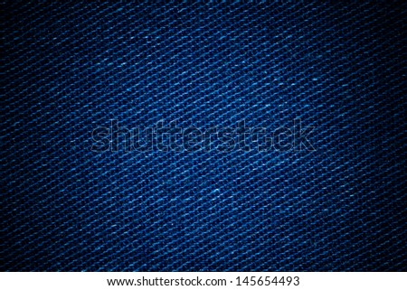 Dark blue denim background.Closeup