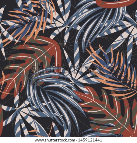 Trend seamless pattern with colorful tropical leaves and plants on a dark background. Vector design. Jungle print. Flowers background. Printing and textiles. Exotic tropics. Fresh design.