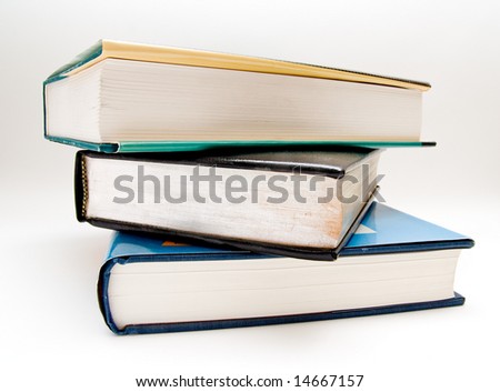 Three large textbooks stacked on top of each other.