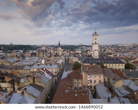 Aerial roofs and streets Old City Lviv, Ukraine. Central part of old european city in morning. Panorama of the ancient town. City Council, Town Hall, Ratush, old Latin Cathedral Church. Drone shot