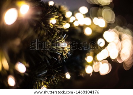 Christmas tree with lights and ornaments, dark background