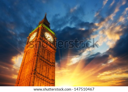 London, Wonderful upward view of Big Ben Tower and Clock at sunset.