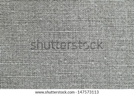 Texture of fabric of brown color from flax for a background and a surface