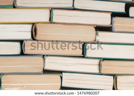 Old and used hardcover books. Educational concept. Closeup