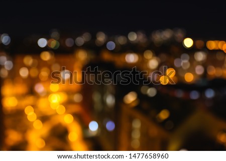 Blurred view of modern city at night. Bokeh effect