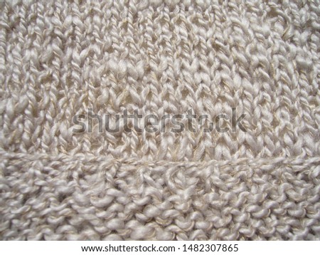 Knitwear texture. Handmade knitted natural fabric