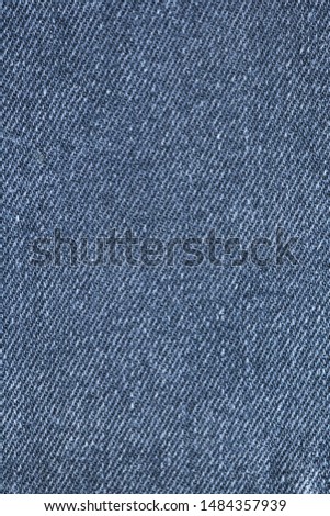 dark blue jeans vertical texture background. close-up denim highly detailed top view. copy space & surface for any design.