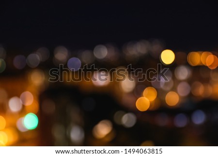 Blurred view of modern city at night. Bokeh effect