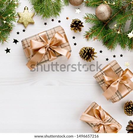 Christmas card with fir branches, gift boxes, golden decor and wooden ornaments, confetti with snow. Christmas flat lay