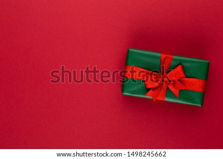 Gift or present box on color table top view. Flat lay composition for birthday, mother day or wedding.