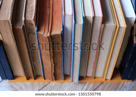 Close-up of many old books arranged in the library selective focus and shallow depth of field