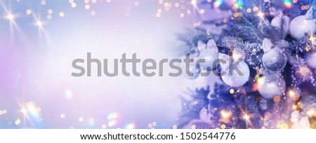 Christmas and New Year holidays background. Glitter lights backdrop. Winter season. Text space. Closeup of Christmas-tree.
