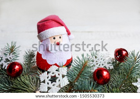 Christmas card on wooden top with christmas ornaments