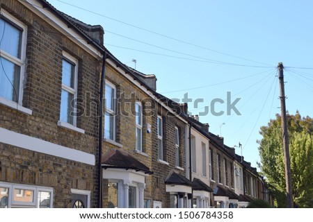 beautiful terrace of Victorian houses on a tree lined road in Stratford, London, E15