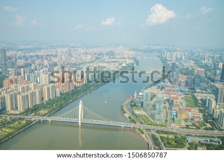 bird view of magnificent cityscape along Pearl River in Guangzhou (Canton) Guangdong, China (with Liede Bridge in front) 
