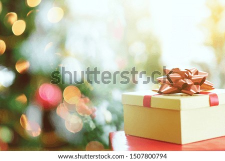 Merry Christmas concept with double exposure of gift box and lighting background.